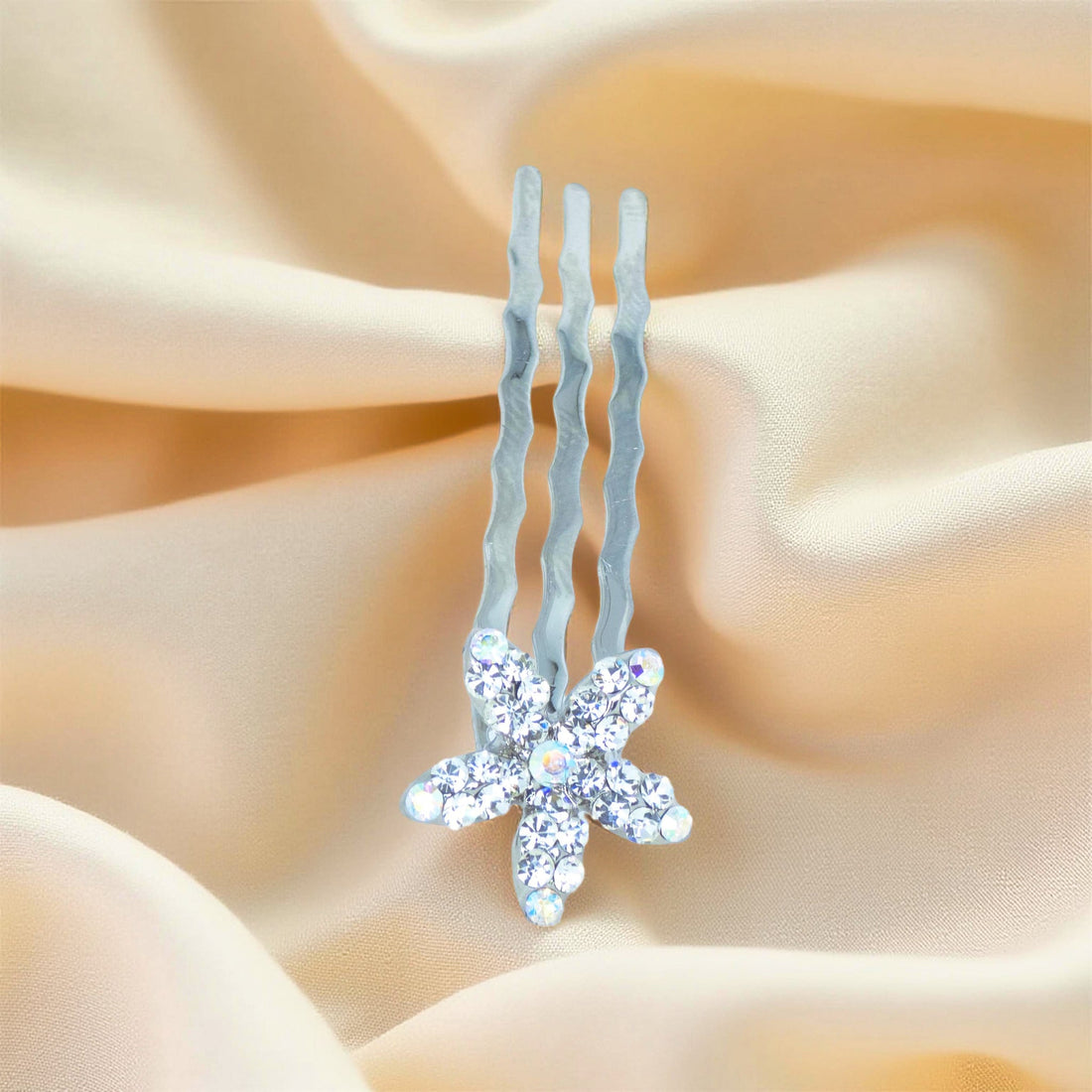 Haerime Starpetal Minis in Clear – close-up of icy pavé petals on polished mini comb set against neutral fabric
