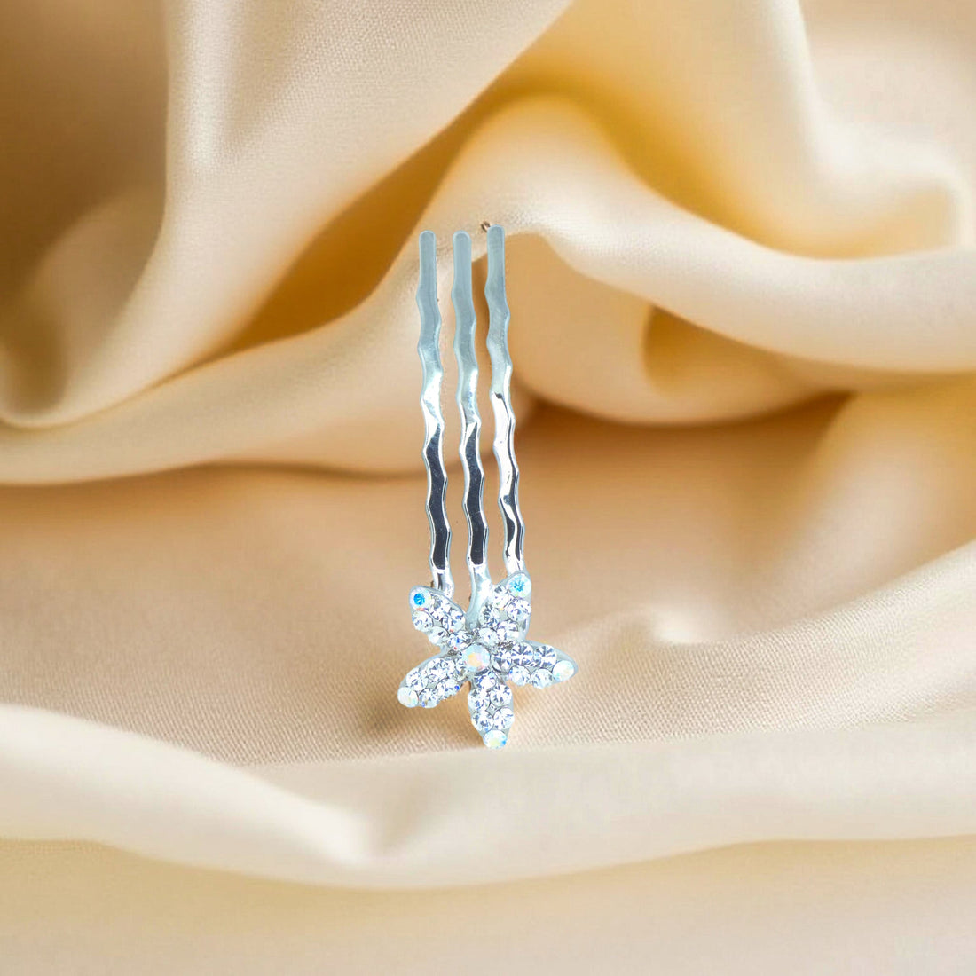 Haerime Starpetal Minis in Clear – translucent white flower pin placed on champagne satin with natural light gradient